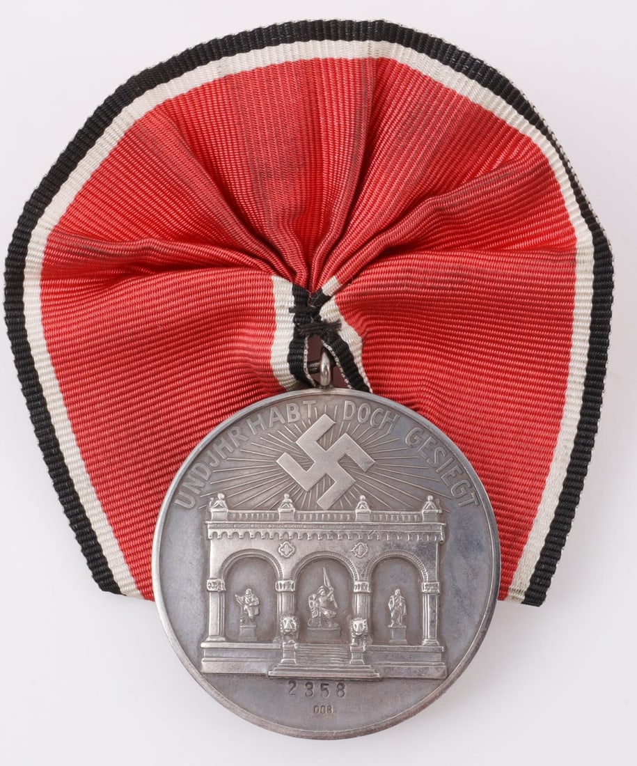 WWII GERMAN THIRD REICH BLOOD ORDER MEDAL: 800 silver construction. Numbered 2358. 1.5 inches. This lot has a reserve.