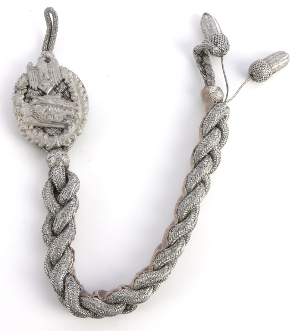 WWII GERMAN MARKSMANSHIP CORD FOR PANZER TROOPS: Silver bullion with badge. Two acorns for higher grade. 16 inches. Very good condition. This lot has a reserve.