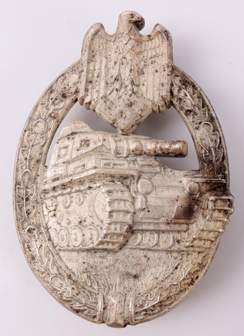 WWII GERMAN THIRD REICH PANZER ASSAULT BADGE: Silver Third Reich WWII German Panzer Assault badge. Silver plating. Back marked, "DH." 180 degrees, C-clasp. 2 1/4 inches. Very good condition. Unauthenticated, sold as is.