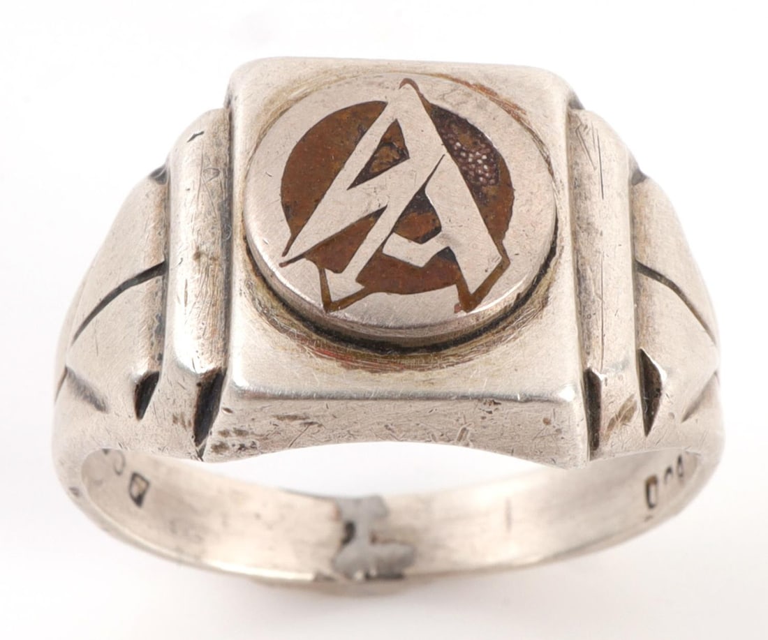 WWII GERMAN THIRD REICH STURMABTEILUNG RING SILVER: Sturmabteilung ring in silver. Thunderbolt SA decal embedded on front. Size 9.5. Stamped 800. 5.8 grams. Very good condition. Unauthenticated, sold "as is." This lot has a reserve.