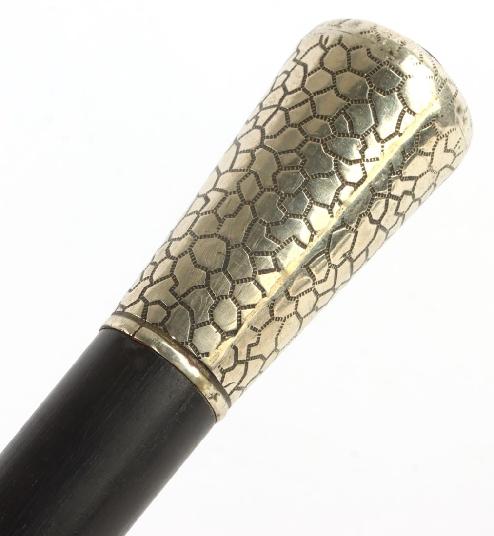 ANTIQUE SILVER GRIP WALKING STICK CANE: Grip acid tests for silver. Engraved. Wood shaft. 32.75 inches. Very light feel. This lot has a reserve.