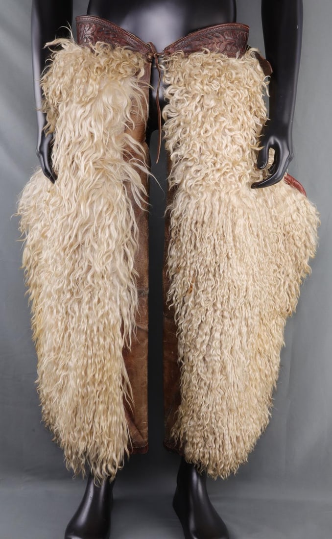RARE WHITE WOOLY ANGORA SHEEP BATWING CHAPS: Pair of white angora wooly sheep chaps. Chaps are in the batwing shape. Produced by Riley & McCormick of Calgary, Canada, in the first half of the 20th century. Wait portion and belt is capable of rea