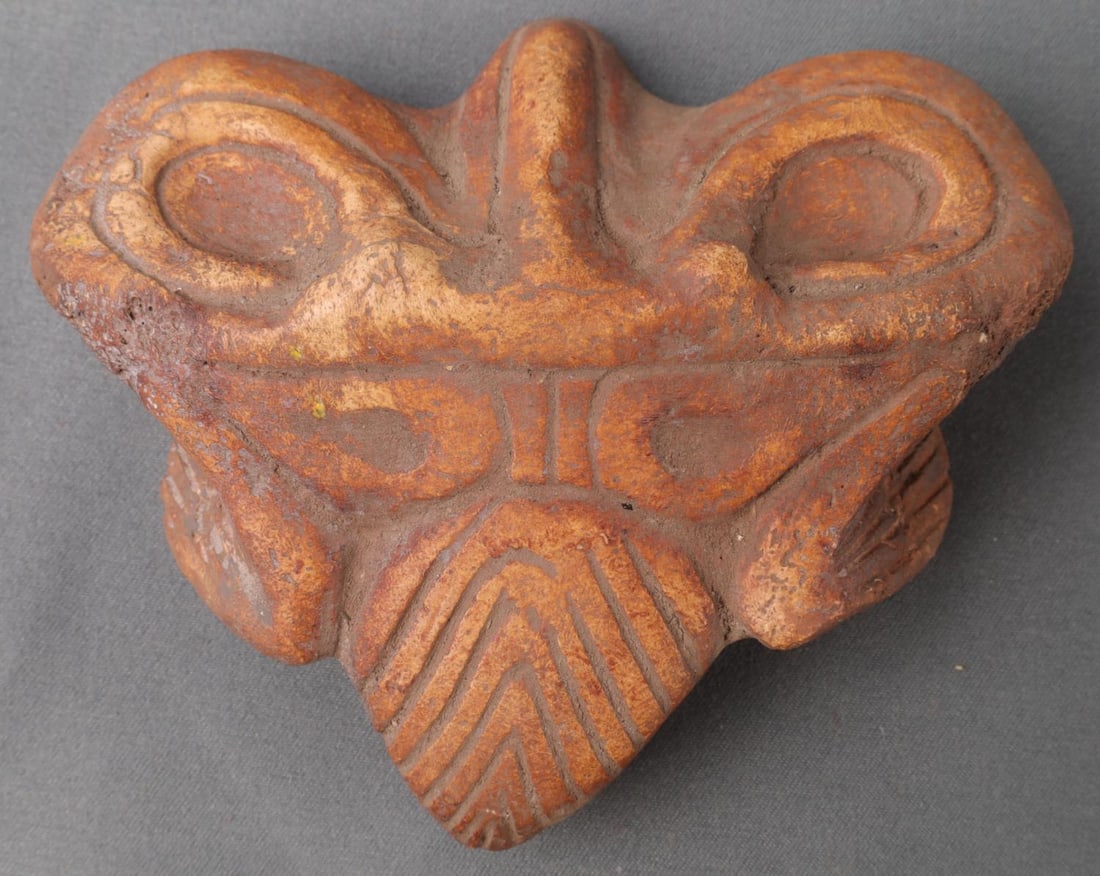 TAINO PRECOLUMBIAN ABSTRACT BIRD EFFIGY MANATEE: Taino. Full figure abstract bird effigy. The broad face and large eye probably represents an owl. Made from the back of a manatees skull. Width 4" Taino Culture. c600-1500 AD. Dominican Republic. Cura