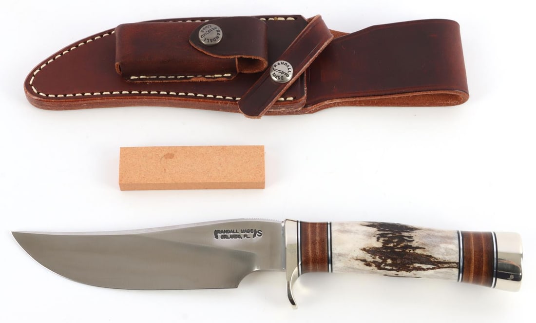 RANDALL MODEL 27 TRAILBLAZER KNIFE STAG GRIP: Stainless steel blade with nickel finger guard, leather spacers, thumb grooves,and duralum butt cap. 5.75-inch blade, 10.5 inches overall. This lot has a reserve.