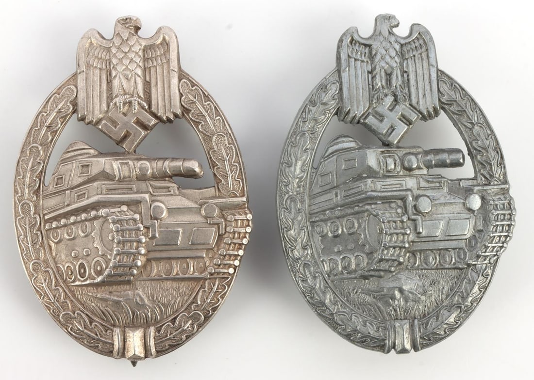 2 WWII GERMAN SILVER GRADE PANZER ASSAULT BADGE: Lot of TWO (2) silver grade Panzer Assault badges. One stamped type and one in zinc. Very good condition. 2 3/8 inches. This lot has a reserve.