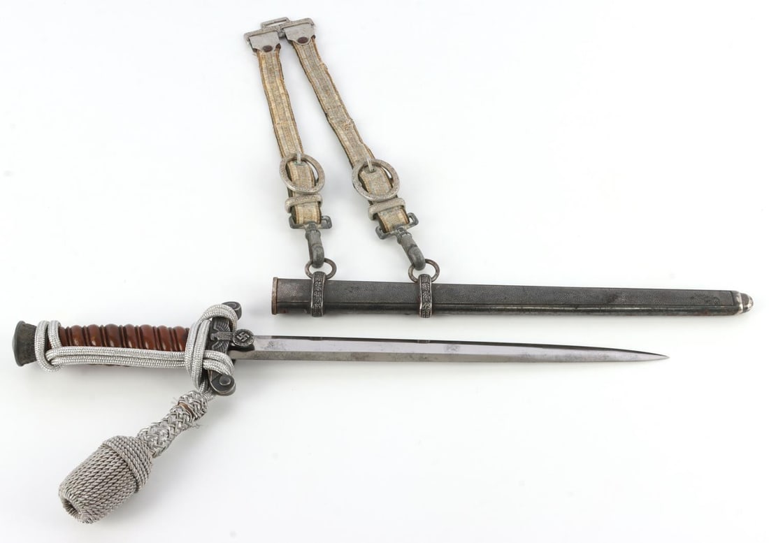 WWII GERMAN THIRD REICH HEER DAGGER WITH HANGER: Heer officer's dagger with brown bakelite handle and steel blade. Guard is Reichsadler. Spiraled handle. Pommel has cluster of oak leaves pattern. 10-inch blade is stamped "Tiger Solingen.". 5-inch ha
