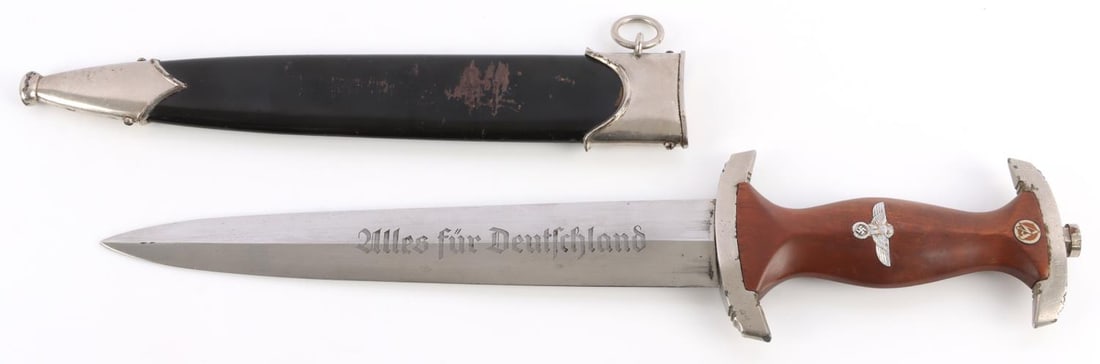 WWII GERMAN THIRD REICH SA DAGGER M7/13: Arthur Schuttelhofer make. Steel blade with etched motto and RZM mark. Plated crossguards with casting marks on interior. Tang does not feature filing. Wood grip with inlaid eagle and SA runes. 8 5/8-
