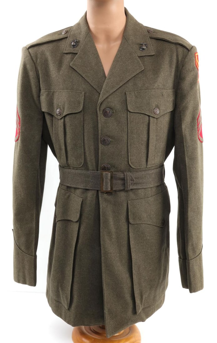 WWII US MARINE CORPS 5TH DIVISION SERGEANT TUNIC: WWII USMC green wool tunic with sleeve patches of a 5th Marine Division platoon sergeant. 36-inch chest, 30-inch back. Good condition. A few loose threads, pinholes.