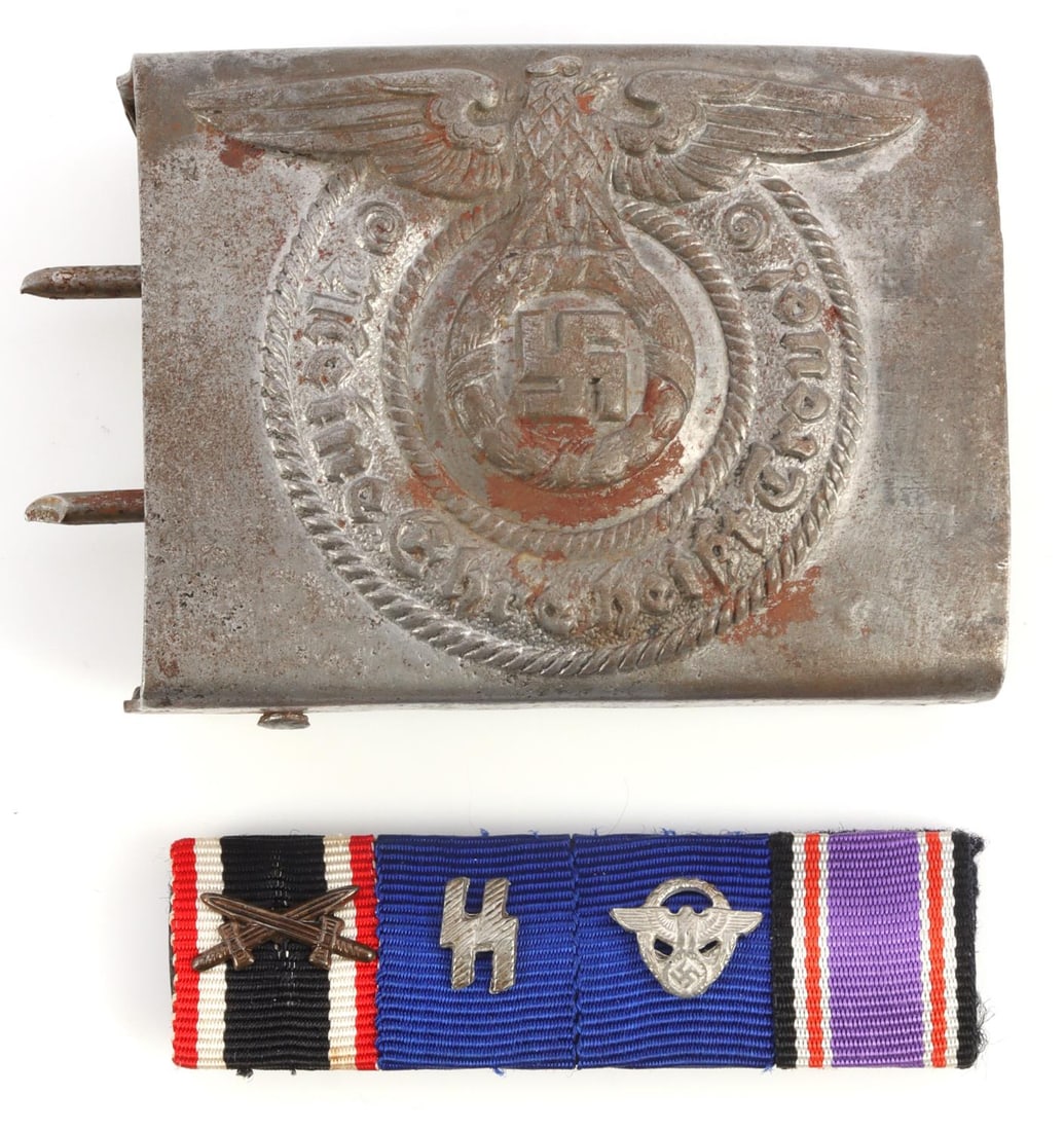 LOT 2 WWII GERMAN UNIFORM ITEMS BUCKLE RIBBON BAR: Lot of TWO (2) WWII German uniform items. Includes: 1) One (1) SS belt buckle. Approx. 2.5 X 2 inches. Moderate rust. No markings noted. 2) One (1) 4-place ribbon bar (3 used). Approx. 2.25 X .75 inch