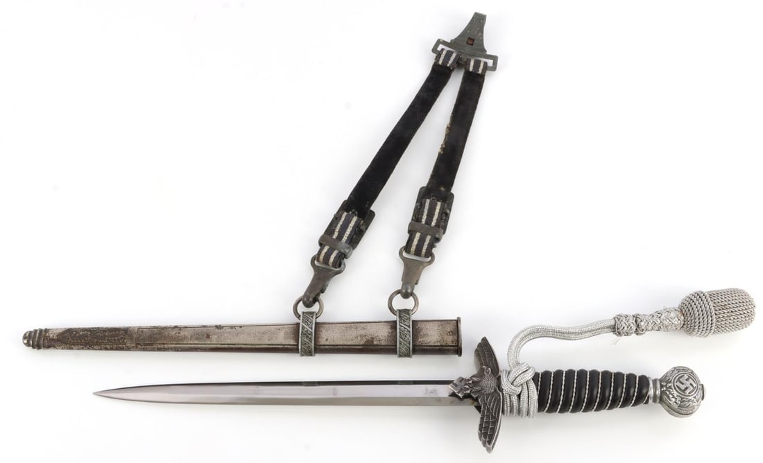 WWII GERMAN REICH 2ND MODEL LUFTWAFFE DAGGER: Steel blade with no maker. Replaced celluloid grip. Aluminum crossguard and pommel. Housed in steel scabbard. 16.75 inches. Pommel needs to be fixed. This lot has a reserve.