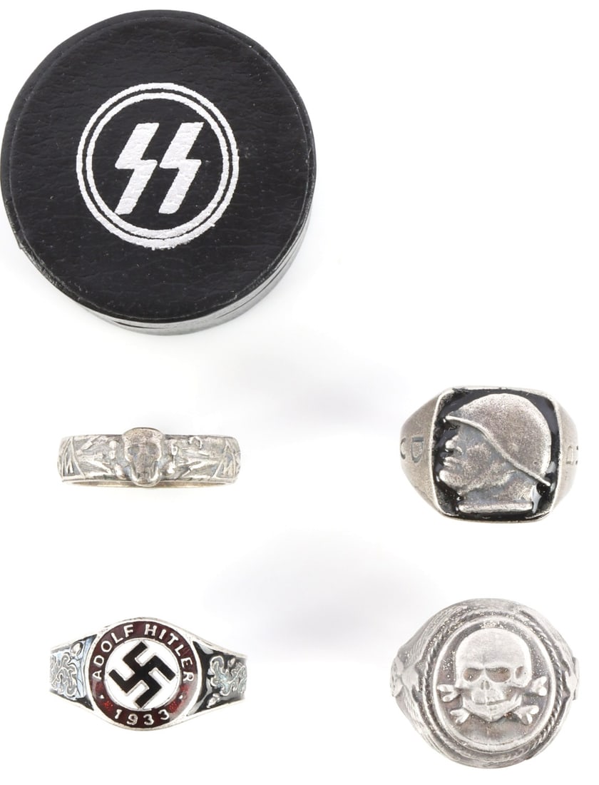 LOT OF 4 WWII GERMAN THIRD REICH SILVER RINGS SS: Lot of FOUR (4) silver and enamel rings. 1) NSDAP ring. 6.529 grams. Size 12.5. 2) Totenkopf and Reichsadler ring. 12.373 grams. Size 8.5. 3) Mussolini in Stahlhelm ring. 7.819 grams. Size 10.5. 4) Eh