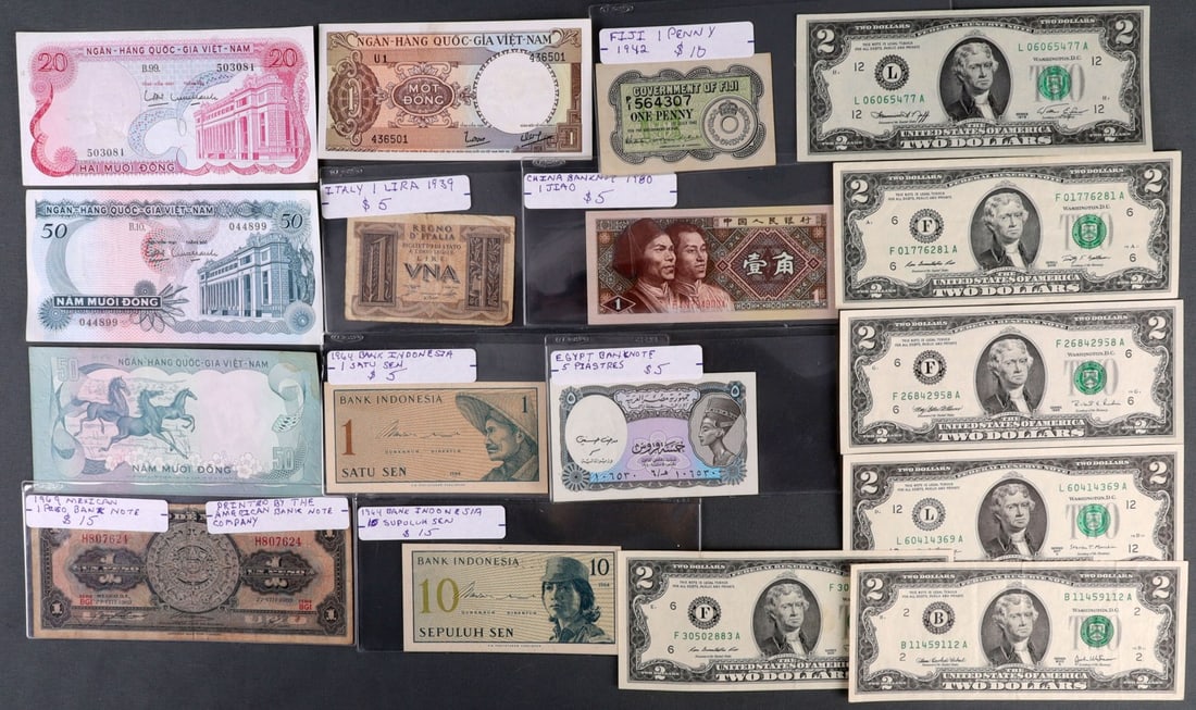 LOT OF ASSORTED WORLD & U.S. BANKNOTE CURRENCY: Lot includes six (6) uncirculated U.S. Bicentennial $2.00 notes, and a good variety of world notes. Ex-dealer priced stock. Most uncirculated, a few are not.