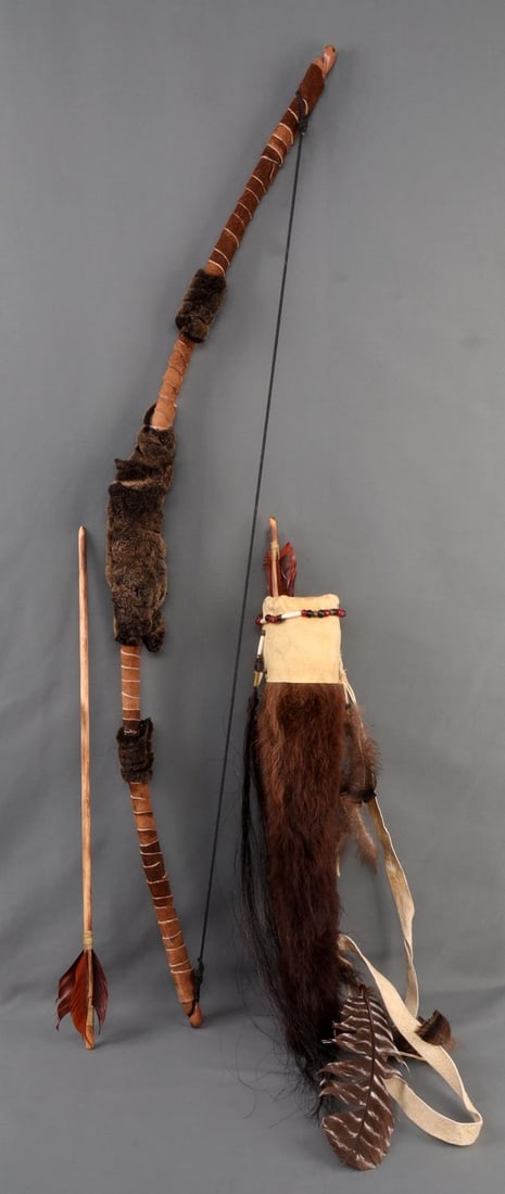 FANTASY BOW QUIVER ARROW AND KNIFE LOT: Lot includes: 1) 45-inch bow wrapped in fur and leather. 2) 21-inch quiver. Fur and leather construction with beads and feathers. 3) Three (3) wooden arrows with wooden tips, 23.5 inches each. Lot in