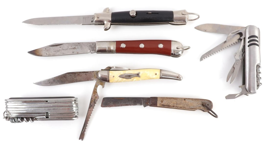 LOT 6 ANTIQUE KNIFE POCKET LOCKING & SWITCHBLADE: Lot of SIX (6). 1) Stainless steel multi-tool pocket knife, Swiss Army model but not Swiss Army make.. Stamped 'Stainless.' 3.75 inches. 2) Stainless steel multi-tool pocket knife. Stamped 'Stainless 