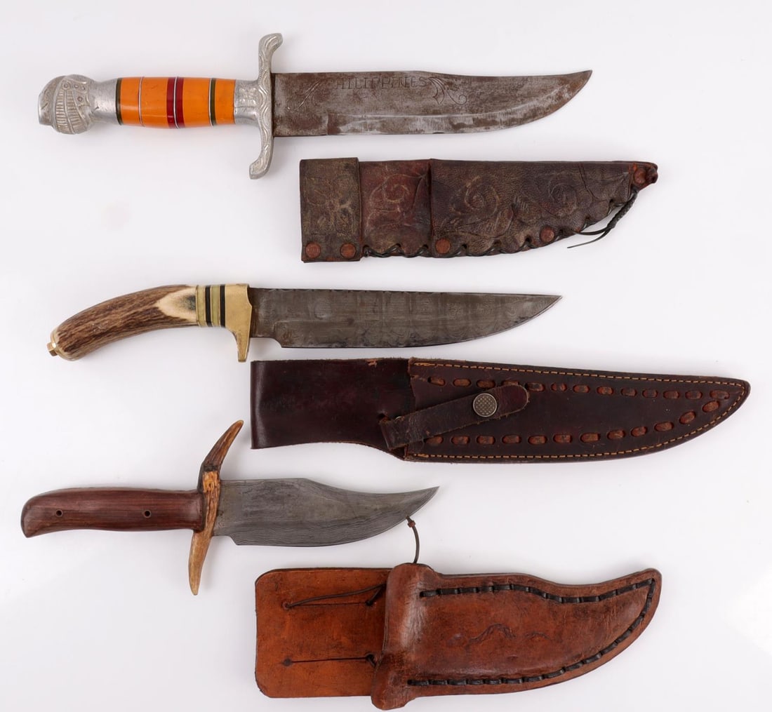LOT OF 3 CONTEMPORARY KNIFE DAMASCUS PHILIPPINES: Lot of THREE (3). 1) Contemporary Damascus steel knife with antler handle. 8 inch blade with scalloped design along back. 2) Knife with 'Philippines' engraved on blade. Multi-piece handle.. 8.25 inch 