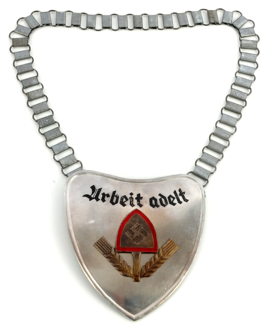 WWII GERMAN THIRD REICH RAD LABOR FRONT GORGET: Third Reich RAD/Labor Front gorget. Bears the RAD symbol of two sheaves of wheat with a shovel bearing a swastika and the phrase 'Arbeit Adelt' (Work Ennobles). 'DRGM' stamp on back pront. Field gray