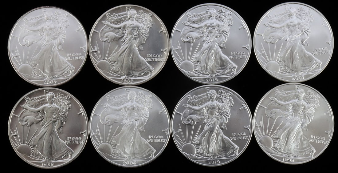 8 MIX DATE SILVER AMERICAN EAGLE 1 OZT BU COIN LOT: Lot of EIGHT (8). Dates include: 1989 (X2), 1999 (X1), 2004 (X1), 2006 (X1), 2007 (X1), and 2019 (X2). All brilliant uncirculated. This lot has a reserve.