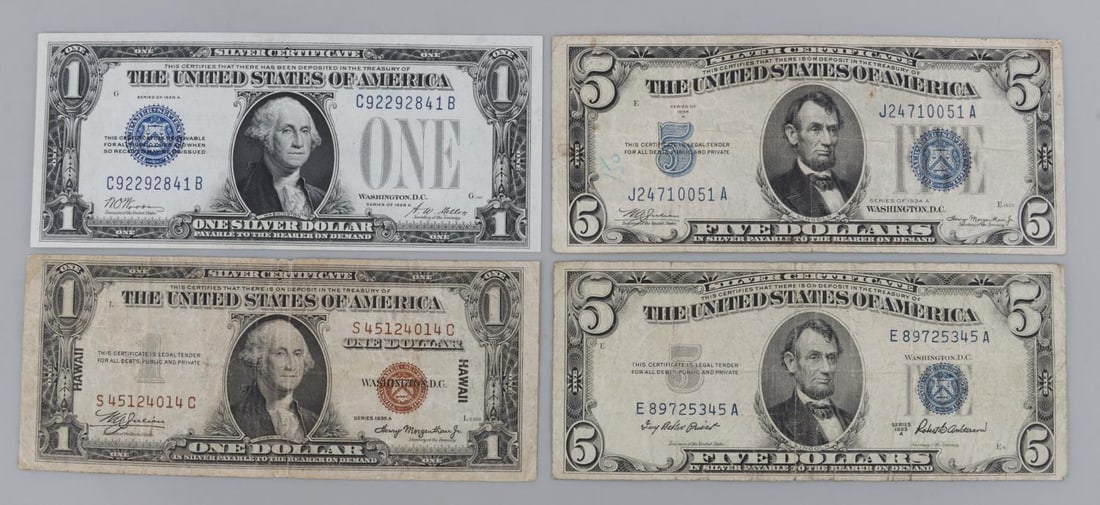 4 U.S. CURRENCY LOT FUNNY BACK HAWAII SILVER CERT: Lot of FOUR (4). Includes 1928 uncirculated "Funny Back" silver certificate, WWII Hawaii replacement note VG, 1953 Blue seal $5.00 silver certificate G, and 1934 Blue seal $5.00 silver certificate CG.