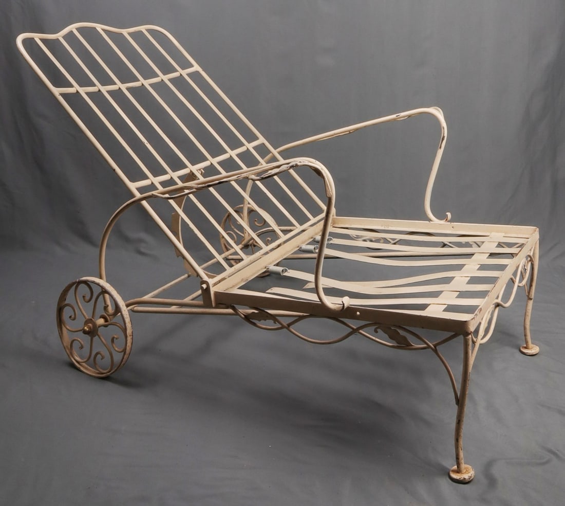 VINTAGE SALTERINI STYLE PATIO CHAISE LOUNGE: Vintage wrought iron Salterini-style European chaise lounge. Adjustable 5-setting backrest and wheels for easily movability. Off white paint. Some normal rust and peeling consistent with age and type