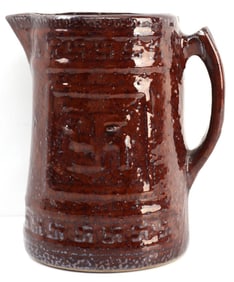 20TH CENTURY PITCHER WITH LUCKY SWASTIKA