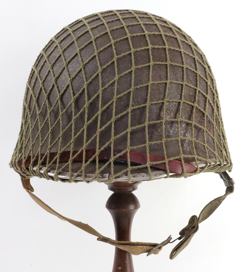 WWII FIXED BALE M1 HELMET W CAPAC LINER: Nice, original condition. Netting may be post-war. No visible heat stamp due to surface rust, front seam, liner has a 3/4 inch tear and another on the liner sweat band, moderate surface rust on the he