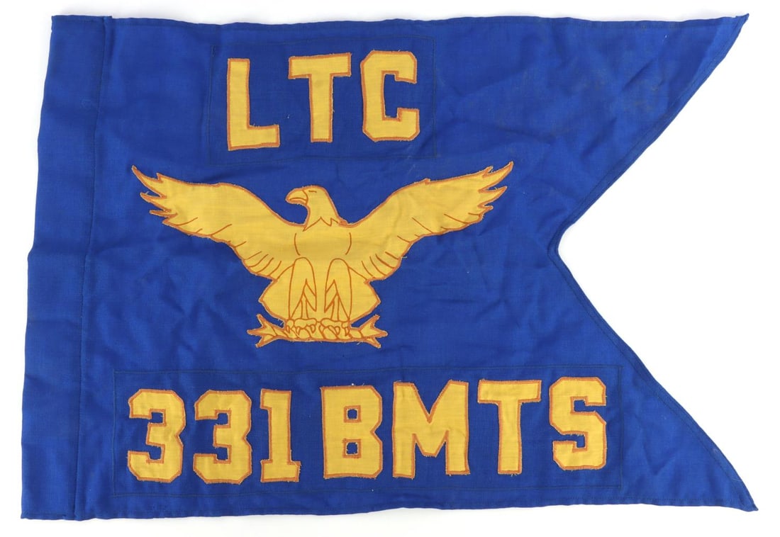 POST WWII US 331ST TRAINING SQUADRON SWALLOWTAIL: A swallowtail pennant flag for the 331st Training Squadron of the United States Airforce. Flag bears an eagle and the words "LTC 331 BMTS." 30 X 20. Very good, original condition.