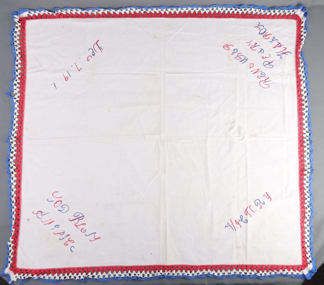 WWII US PEARL HARBOR COMMEMORATIVE TABLECLOTH: Commemorative tablecloth of the attack on Pearl Harbor. Red, white, and blue color scheme. Corners, going clockwise, reads as follows: 'December 7, 1941', 'Remember Pearl Harbor', 'Victory', 'God Bles