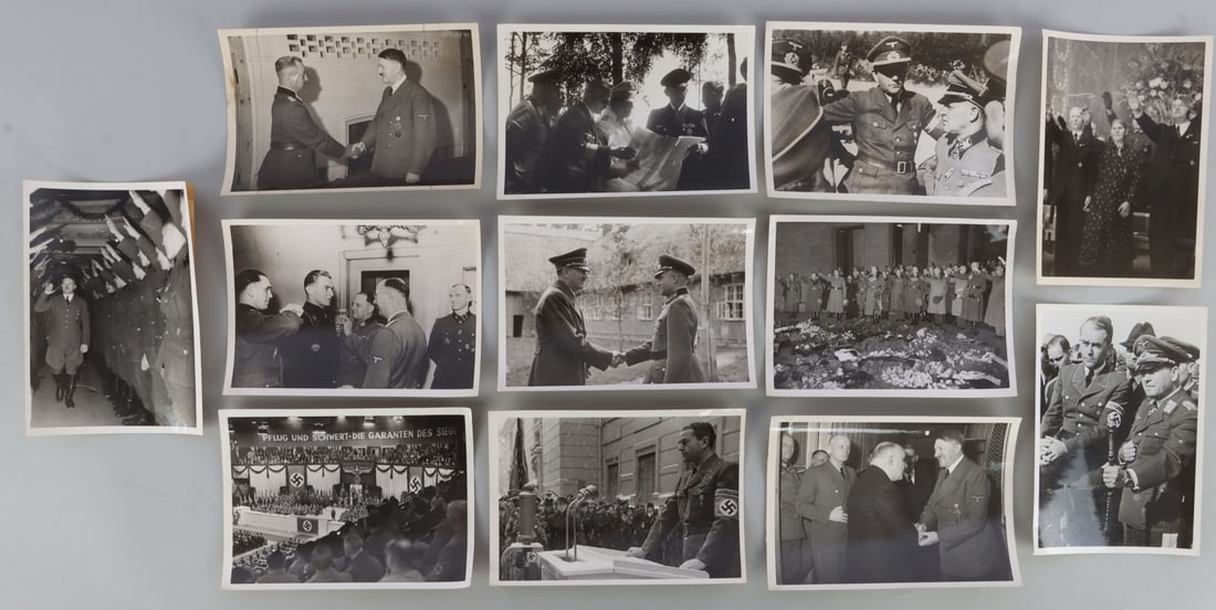 LOT OF 12 WWII GERMAN HEINRICH HOFFMAN PHOTOGRAPHS: Lot of TWELVE (12). Photos all copyrighted by Hoffman. Good photos of Hitler, Goring, SS officers, and more. 5 X 7 1/8 inches.