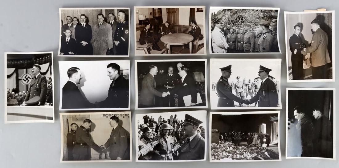 LOT OF 12 WWII GERMAN HEINRICH HOFFMAN PHOTOGRAPHS: Lot of TWELVE (12). Photos all copyrighted by Hoffman. Good photos of Hitler, Goring, SS officers, and more. Approx. 5 X 7 inches.