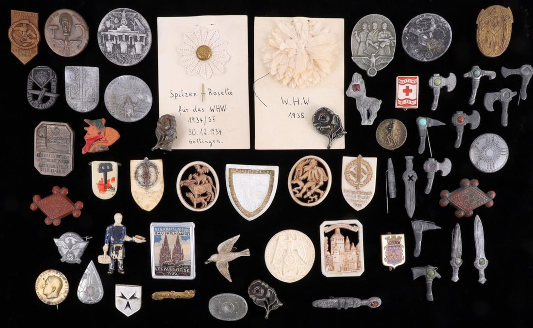 WWII GERMAN THIRD REICH NSDAP TINNIES BADGE LOT: Lot of FIFTY-FOUR (54) WWII tinnies, pins, and badges. Sizes range from 0.5 to 1.5 inches. Lot is in good condition. Unauthenticated, sold "as is."