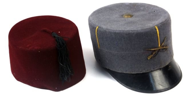 FRENCH FOREIGN LEGION KEPI & ALGERIAN FEZ CAP: Two hats from colonial French Algeria. A French Foreign Legion infantry kepi, and French made Algerian fez cap. Both hats have slight mothing, and inner bands are brittle from age, otherwise good cond