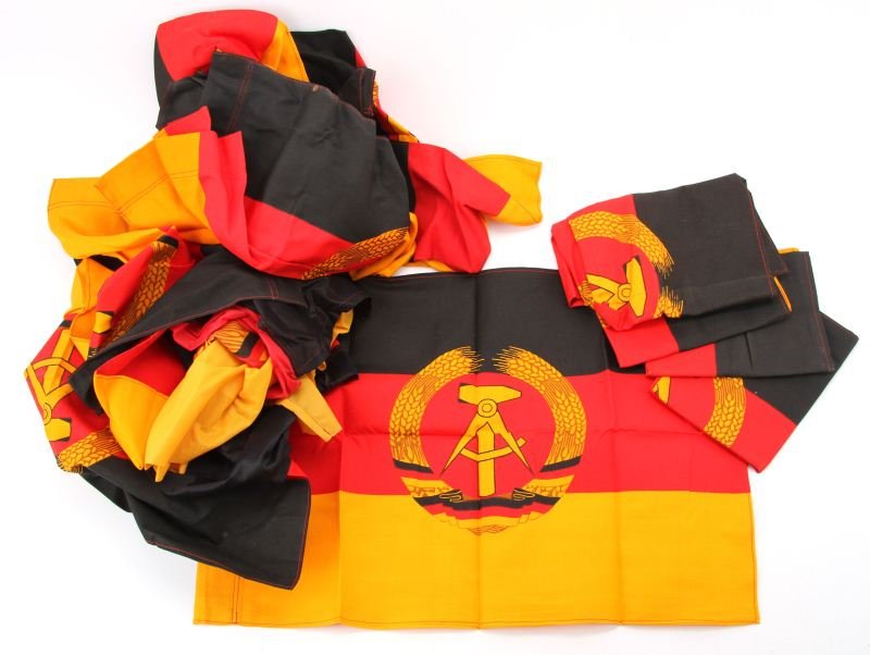 18 EAST GERMAN DEMOCRATIC REPUBLIC FLAGS: Seventeen small, 22 by 15.5 inch flags and one 38 by 23 inch flag. Conditions vary from good to excellent.