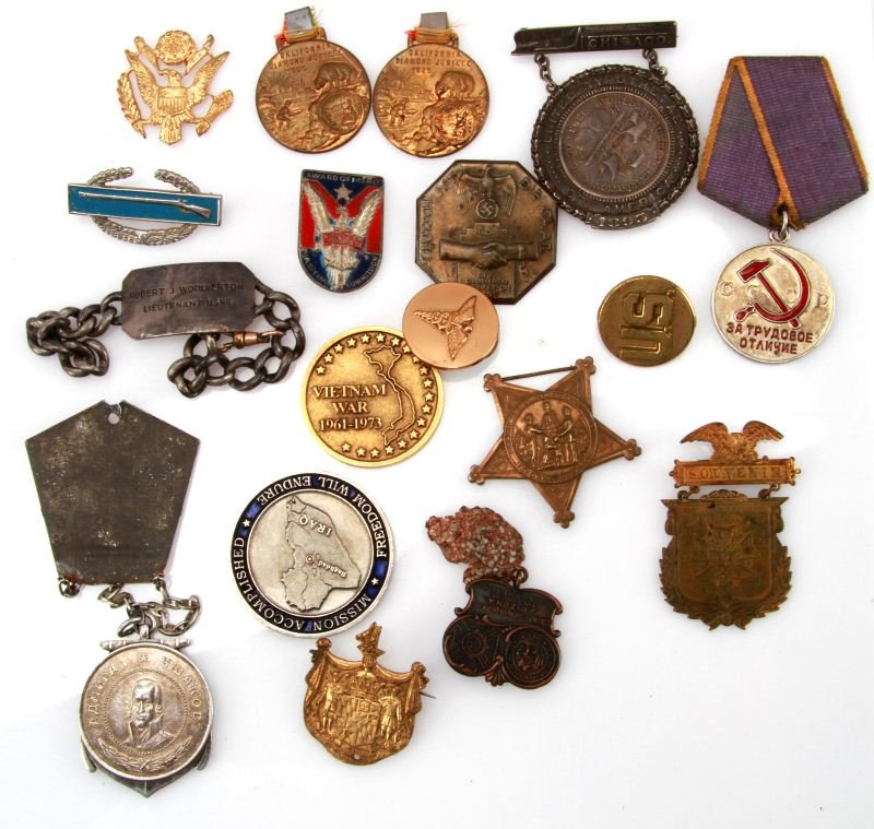GROUP OF MIXED MILITARY MEDALS, PINS, BRACELET: Group includes Russian USSR Soviet Labor Medal, 1925 California Diamond Jubilee, 1934 Deutsch 1st Die SAAR pin badge, rifle pin, Operation Iraqi Freedom coin, Vietnam War coin, Award of Merit Maritime