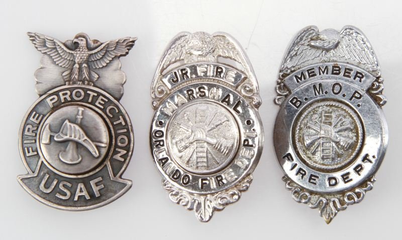 FIREFIGHTER OBSOLETE BADGE LOT USAF ORLANDO BMOP: Three badges averaging two inches, includes Air Force, BMOP Fire Department, and Orlando Junior Fire Marshall, all very good.