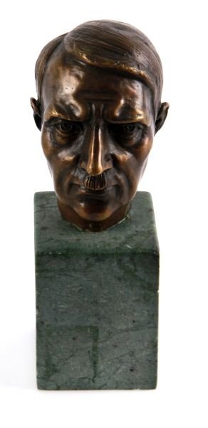 SMALL BRONZE HITLER BUST ON MARBLE: Bust of Third Reich Furher Adolf Hitler (3.5 by 2 inches) on green marble plinth (2 by 2 by 2.75 inch; 6.25 inches total height). Bronze has no signatures or maker's or foundry marks. Bronze is in ver