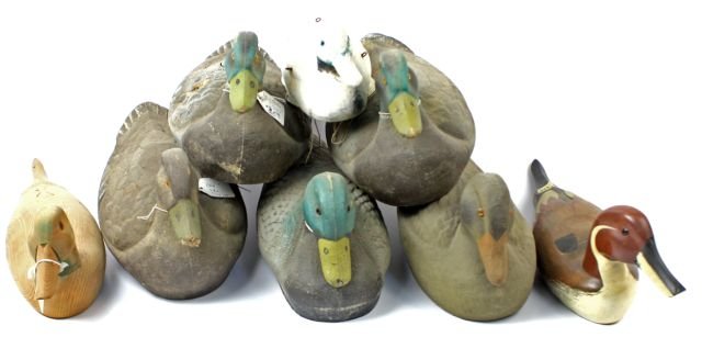 LOT OF EIGHT VINTAGE DUCK DECOYS: Lot of eight vintage duck decoys. Three hand carved wood decoys, two of which are painted, and five 1950's paper mache decoys. Various wear from age and past use, but overall good condition.