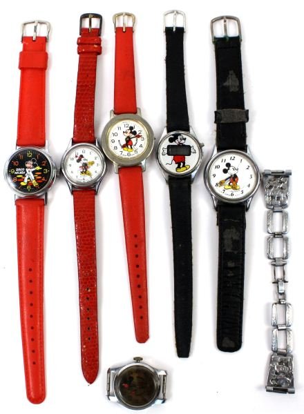 SIX VINTAGE WALT DISNEY MICKEY MOUSE WATCHES: 6 different era Mickey watches including an early metal Mickey bracelet, a digital, more rare "Disco Mickey" and one Minnie watch. Overall good condition with wear.