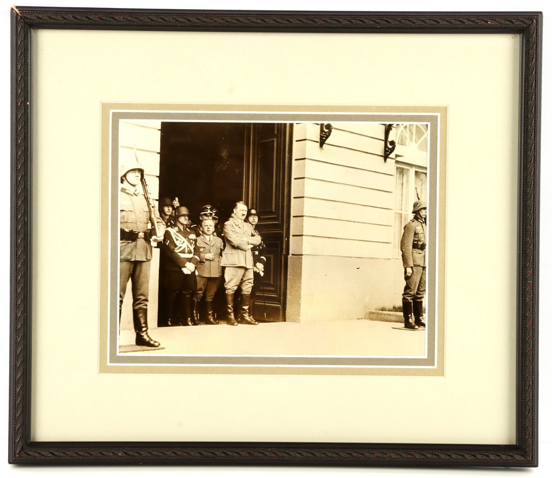 WWII GERMAN THIRD REICH HITLER 48TH BIRTHDAY: Framed photograph of Adolf Hitler and NSDAP/SS high command monitoring troops on parade in commemoration of Hitler's 48th birthday. Figures depicted include Adolf Hitler, Heinrich Himmler, Max Amenn, 