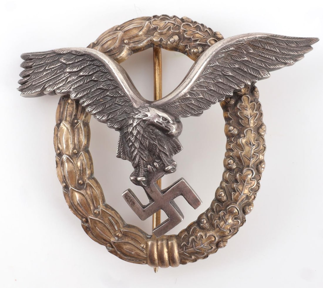 WWII GERMAN LUFTWAFFE PILOT OBSERVER BADGE: WWII German Luftwaffe Pilot Observer's badge. Luftwaffe eagle riveted to a laurel and oak leaf wreath. Eagle marked "800". Reverse wreath engraved "Alles Gulezum Geburtstag" and "Deine Eltern 10-9-194