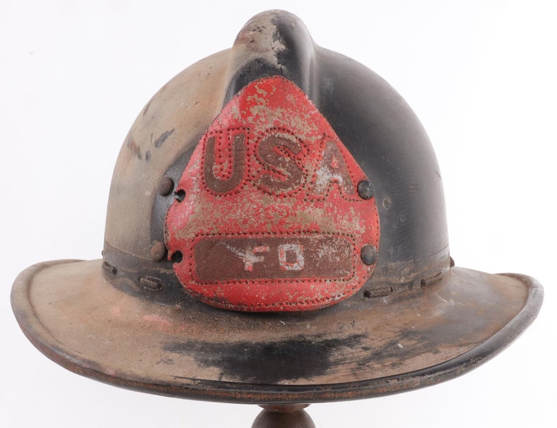ANTIQUE FIREMAN HELMET MSA SKULLGARD USA FD: MSA Skullgard fiber reinforced firefighting helmet ca. 1940. Red leather badge "USA FD" riveted to front. Approx. size 8. Good condition. No cracks. Leather badge partially detached. Liner present, bu