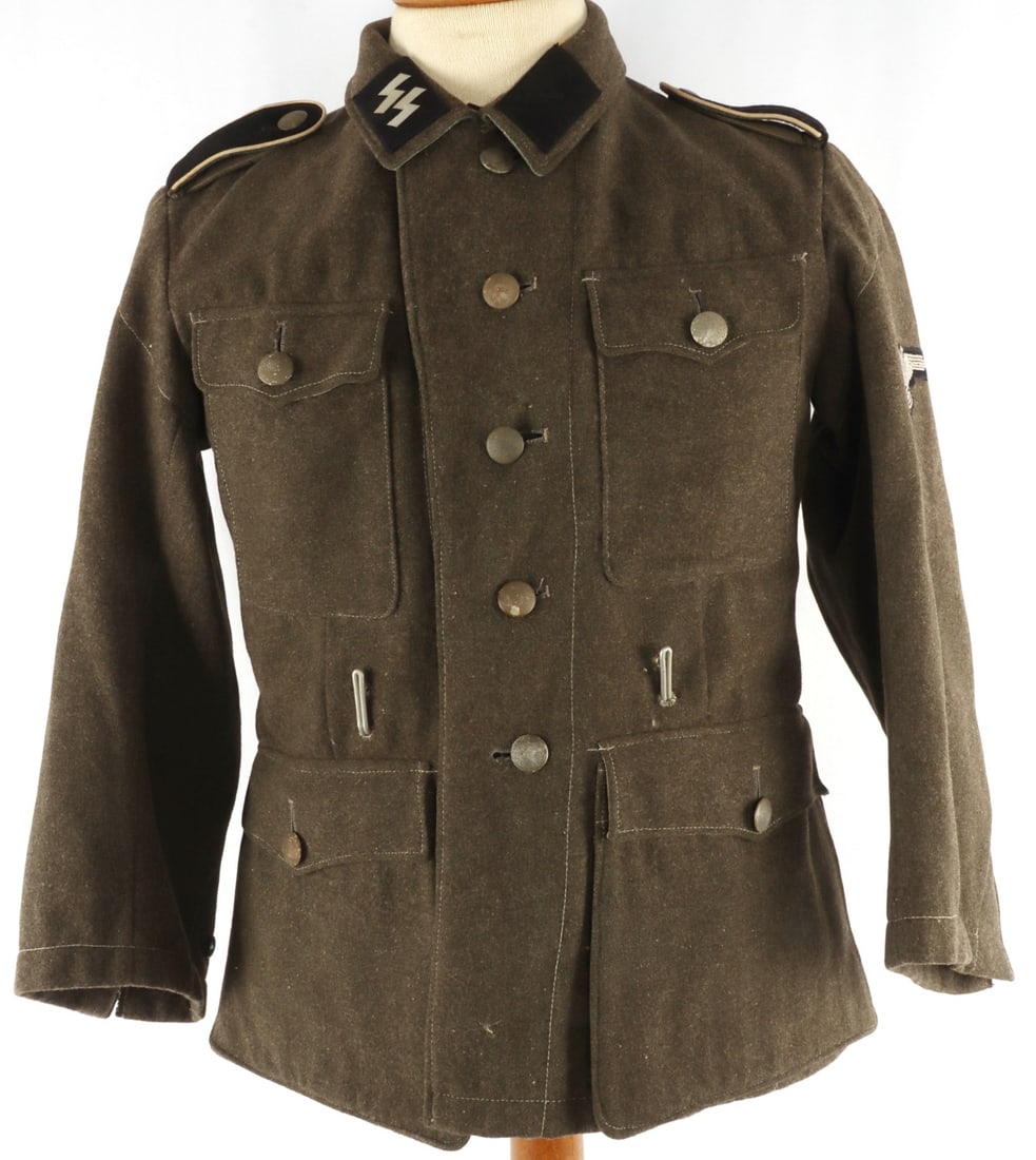WWII LATVIAN WAFFEN SS M40 TUNIC THIRD REICH: WWII German SS m40 tunic. Includes collar tabs, Latvian patch, shoulder boards, Reichsadler patch. Size ink stamped right interior "40/65 97 43/53" Latvian patch fluoresces, may have been replaced. Un