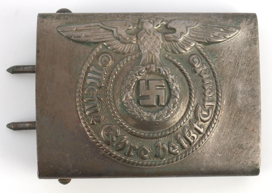 WWII GERMAN THIRD REICH SS BELT BUCKLE: Steel belt buckle. High relief eagle and letters. Marked RODO on back with dog legged buckle catch. Some green finish remaining. 2 5/8 inches. Very good condition. This lot has a reserve.