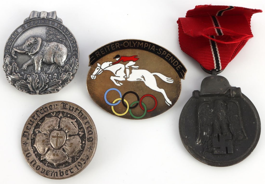 LOT 4 WWII GERMAN 20TH C BADGES OLYMPIC & IMOSTEN: Lot of FOUR (4) assorted badges. Includes German Colonial Elephant's Order, Reiter-Olympia-Spende (marked on reverse "Ges. Gesch. Deutsch.Olymp.-Kom.F.Reiterei"), Medaille Winterschlacht im Osten 1941