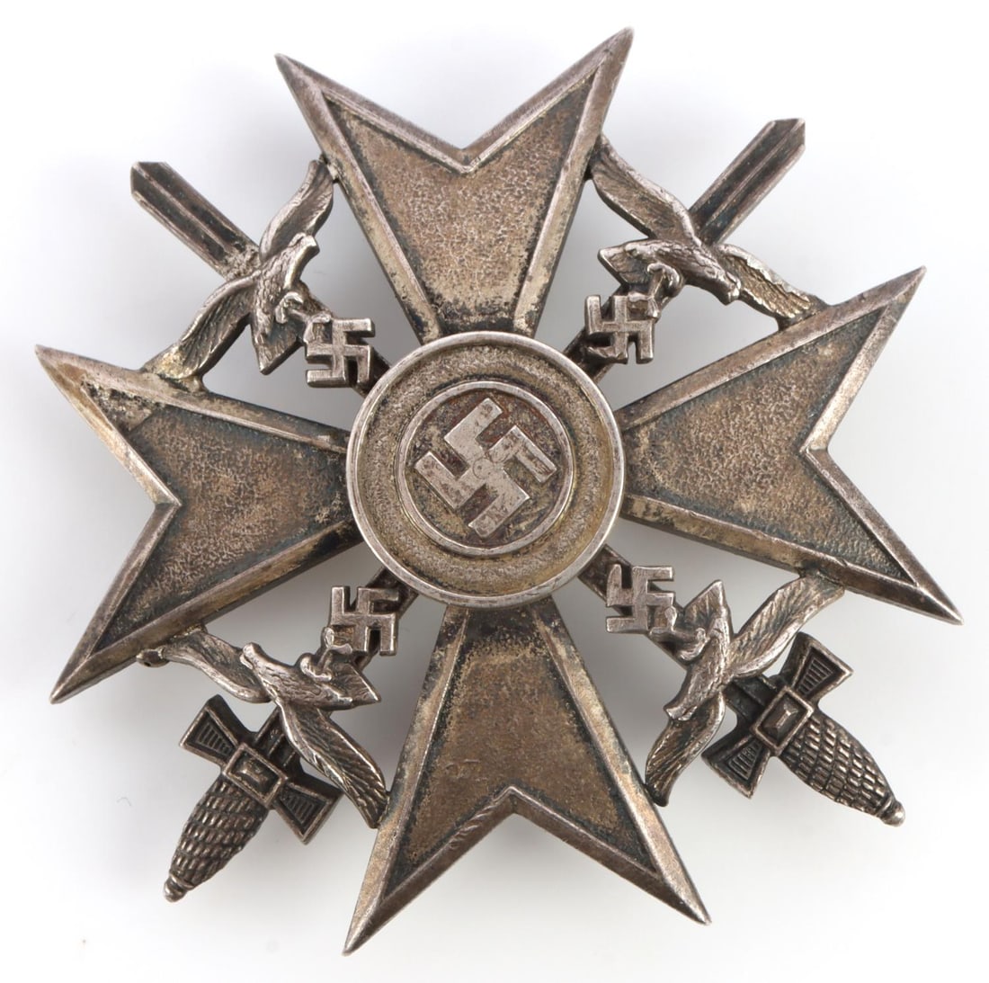 WWII GERMAN CONDOR LEGION SILVER SPANISH CROSS: WWII German Condor Legion Spanish cross in silver. Multi-piece construction with eagles and swastika attached separately. Obverse features a swastika to the center of a pebble cross with swords and Lu