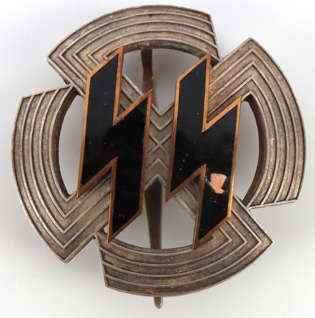 WWII GERMAN THIRD REICH SS SPORTS BADGE: Black enameled SS runes on a silvered nickel frame. It measures 1 7/8 inches. Very good condition.