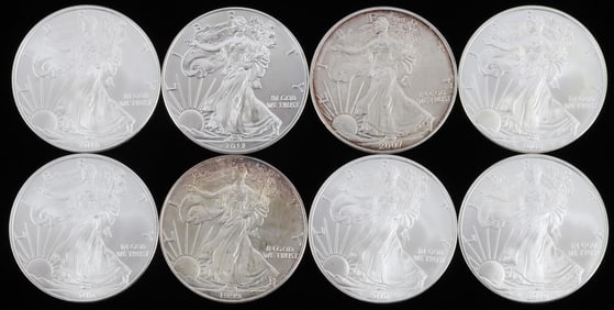 LOT OF 8 MIX DATE SILVER AMERICAN EAGLE COINS