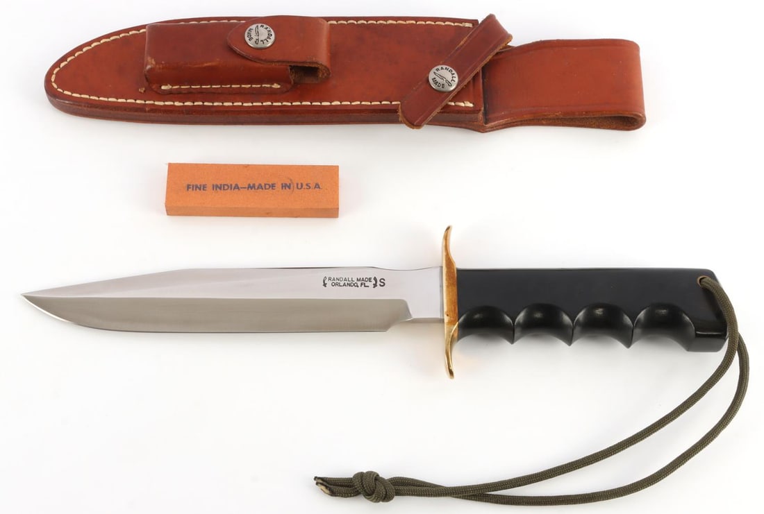 RANDALL MADE MODEL 1 FIGHTER KNIFE: Stainless steel blade with Micarta grip and brass guard. 7-inch blade. Very good condition. Comes with model 7 sheath. This lot has a reserve.