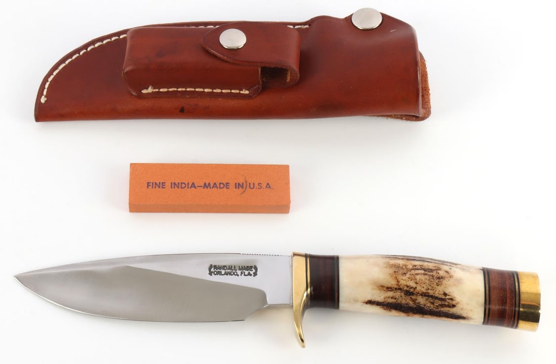 RANDALL MADE MODEL 25 TRAPPER KNIFE: Carbon steel blade, brass finger guard, stag grip. 5- inch blade. Very good condition. This lot has a reserve.