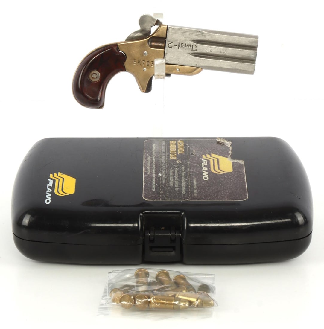 ESTUL TWIST-2 SWIVEL BARREL .22 SHORT DERRINGER: Estul Inc. model Twist-2 swivel barrel rimfire derringer pistol. Spur trigger, brass frame, 2-inch steel barrels, celluloid grip. Frame marked "Estul , Inc / Matthews, N.C." Good condition. Mechanical