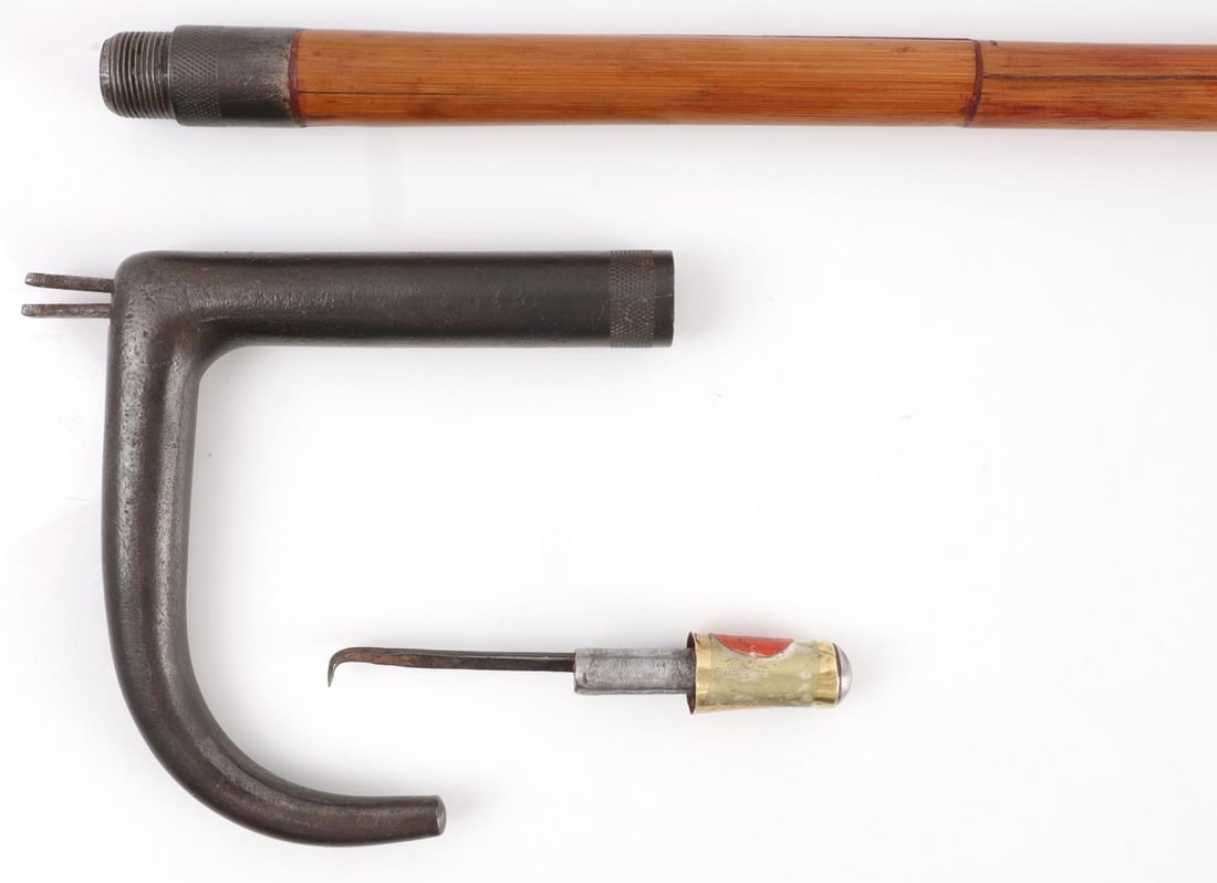 ANTIQUE GENTLEMAN GUN CANE WALKING STICK: Iron handle with steel barrel in wood shaft. 35 inches. Bore features oxidation. Ferrule tip is removed and serves as tool to retract hammer. Breach measures 9.12mm. Tip measures 8.1mm. Functions with